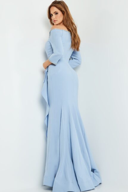 Back view of model wearing Jovani 23190 in light blue, highlighting elegant draping and fitted mermaid style.