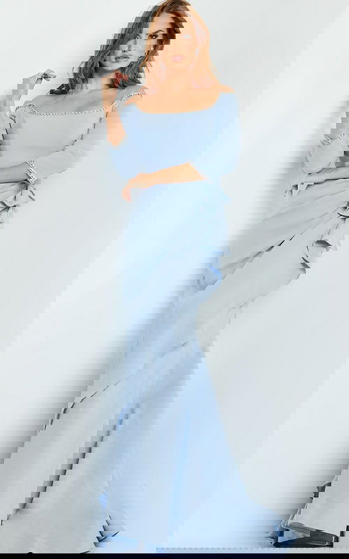 Model wearing Jovani 23190 gown in light blue, front view showing off-the-shoulder neckline and ruffle details.