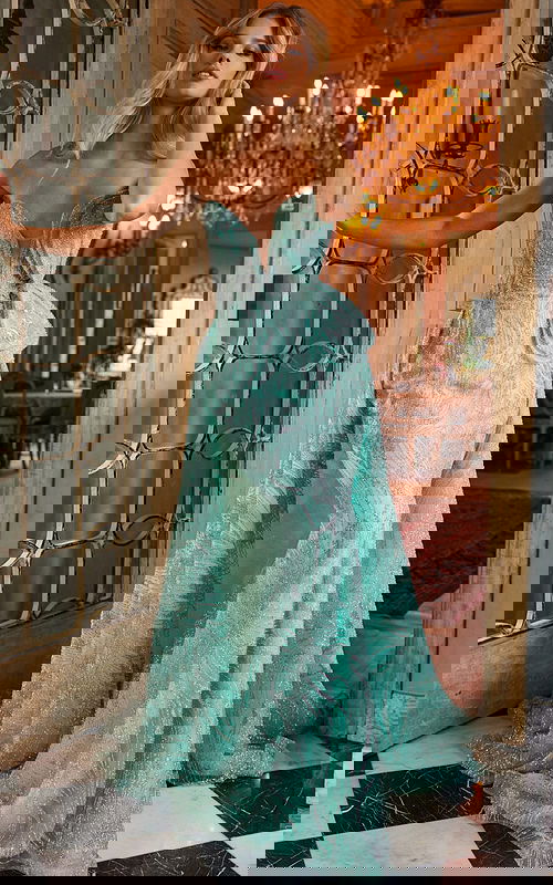 Model wearing Jovani 23361 floor-length green gown with sweetheart neckline, front view.