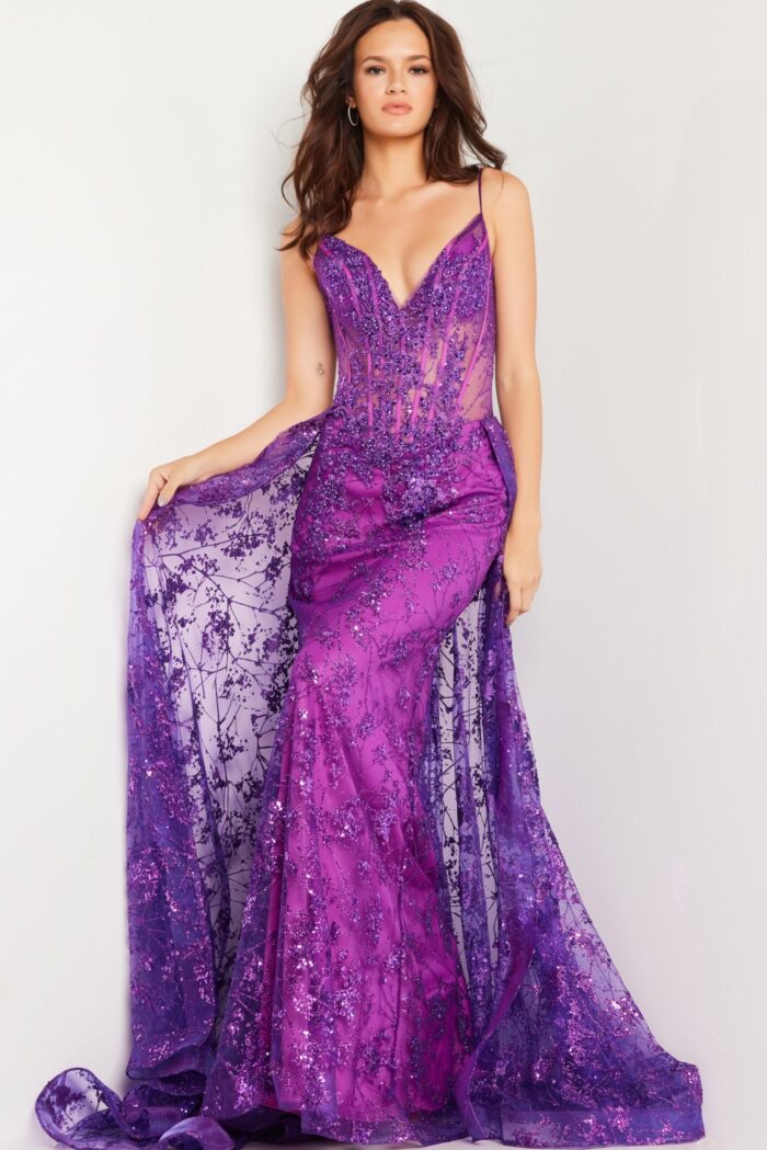 Back view of model in Jovani 23530 purple dress with flowing skirt