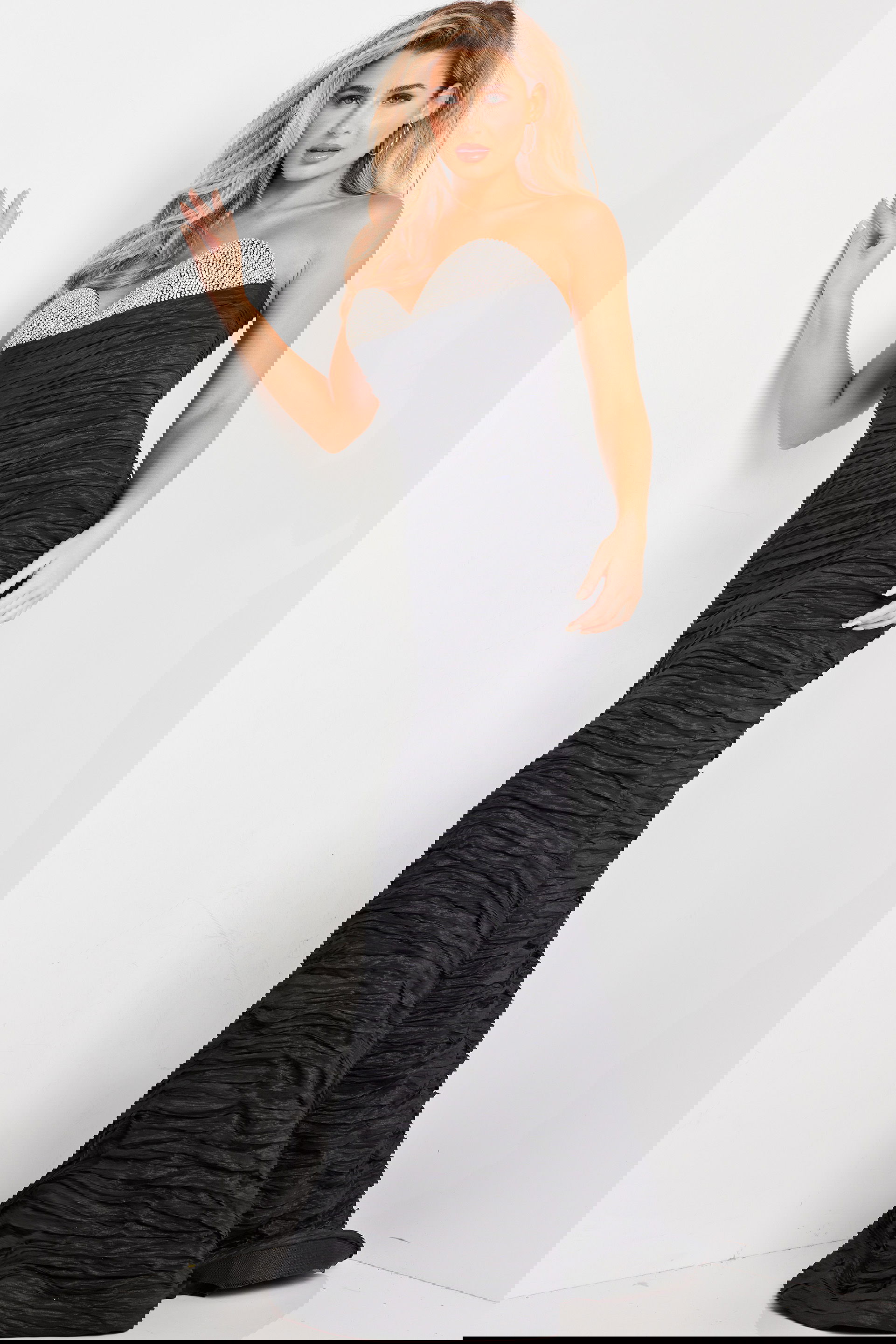 23546_1.jpg Model wearing Jovani 23546 black mermaid gown, front view with sweetheart neckline and embellishments.