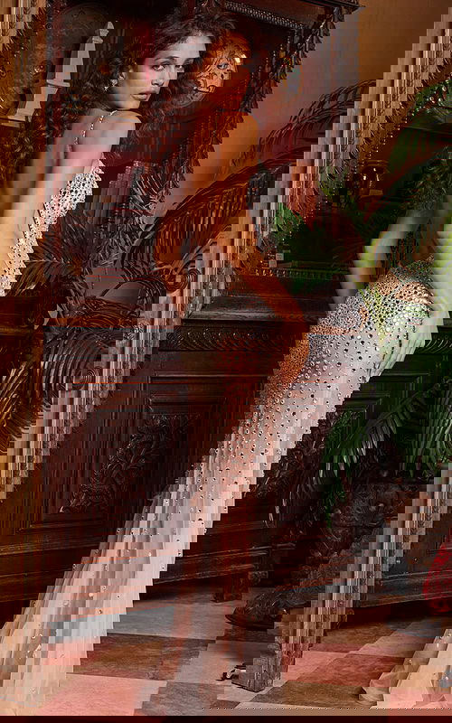 Model wearing silver dress 23635, back view