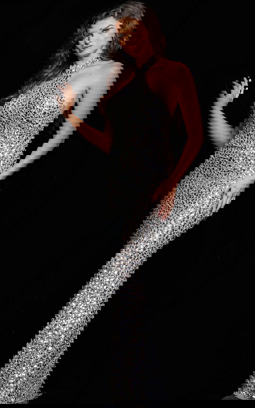 Model wearing Jovani 23652 silver long dress with halter neckline and crystal embellishments, full front view.