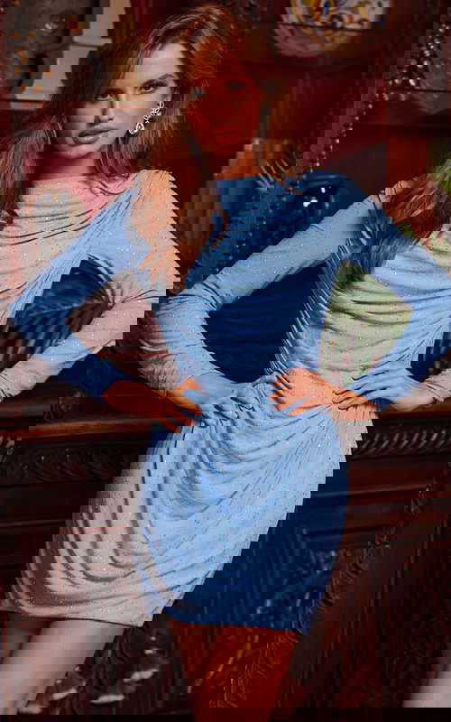 Model wearing Jovani 23888 blue draped mini dress from the front.