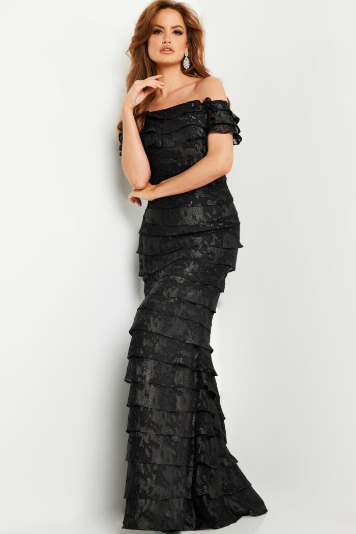 Model wearing Jovani 23890 black dress front view with layered design.