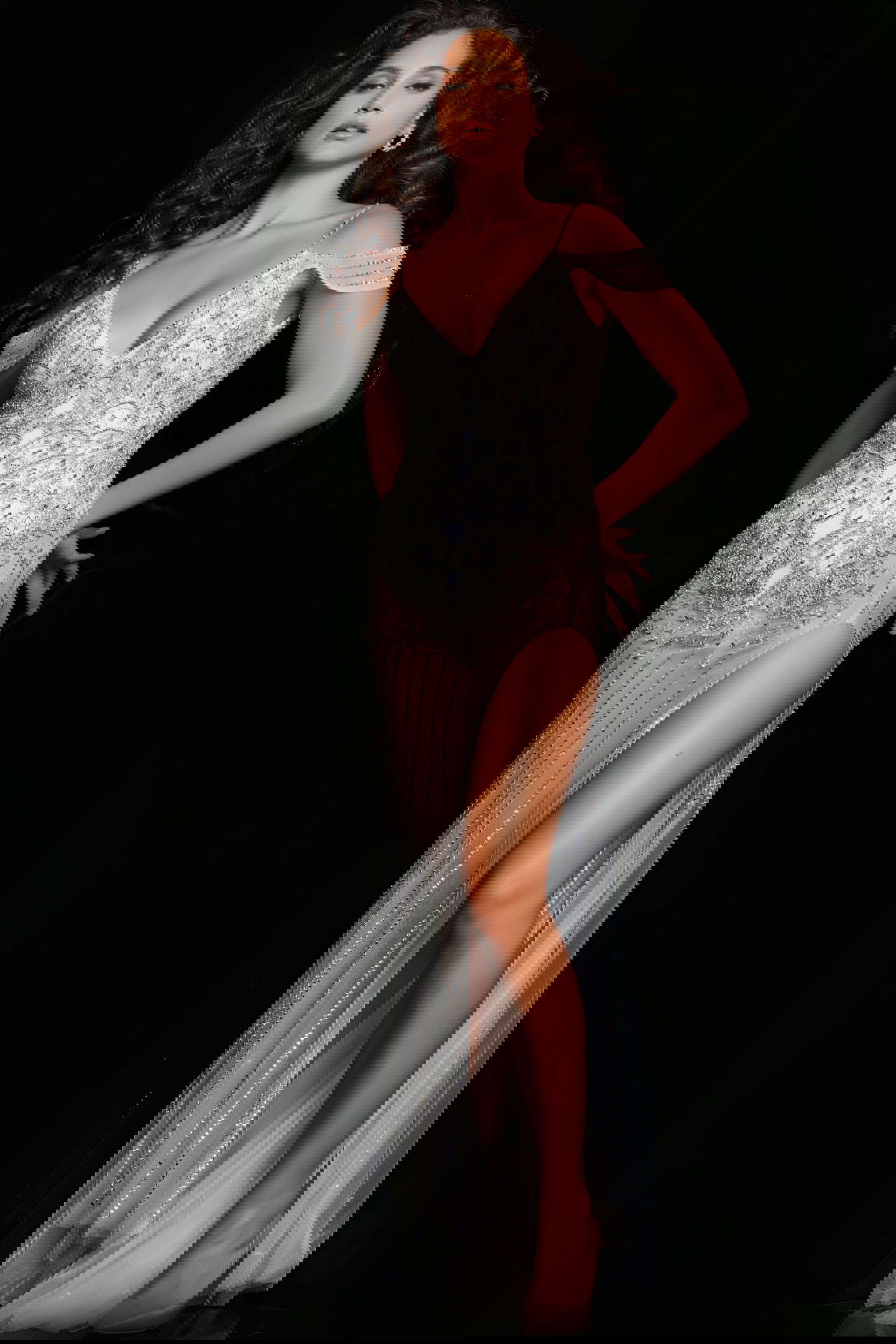 23961_OFFWHITE_15-2.jpg model wearing Jovani 23961 elegant white gown with V-neckline and high slit front view