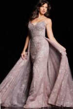 Model wearing Jovani 24001 taupe dress with A-line silhouette and bead details.