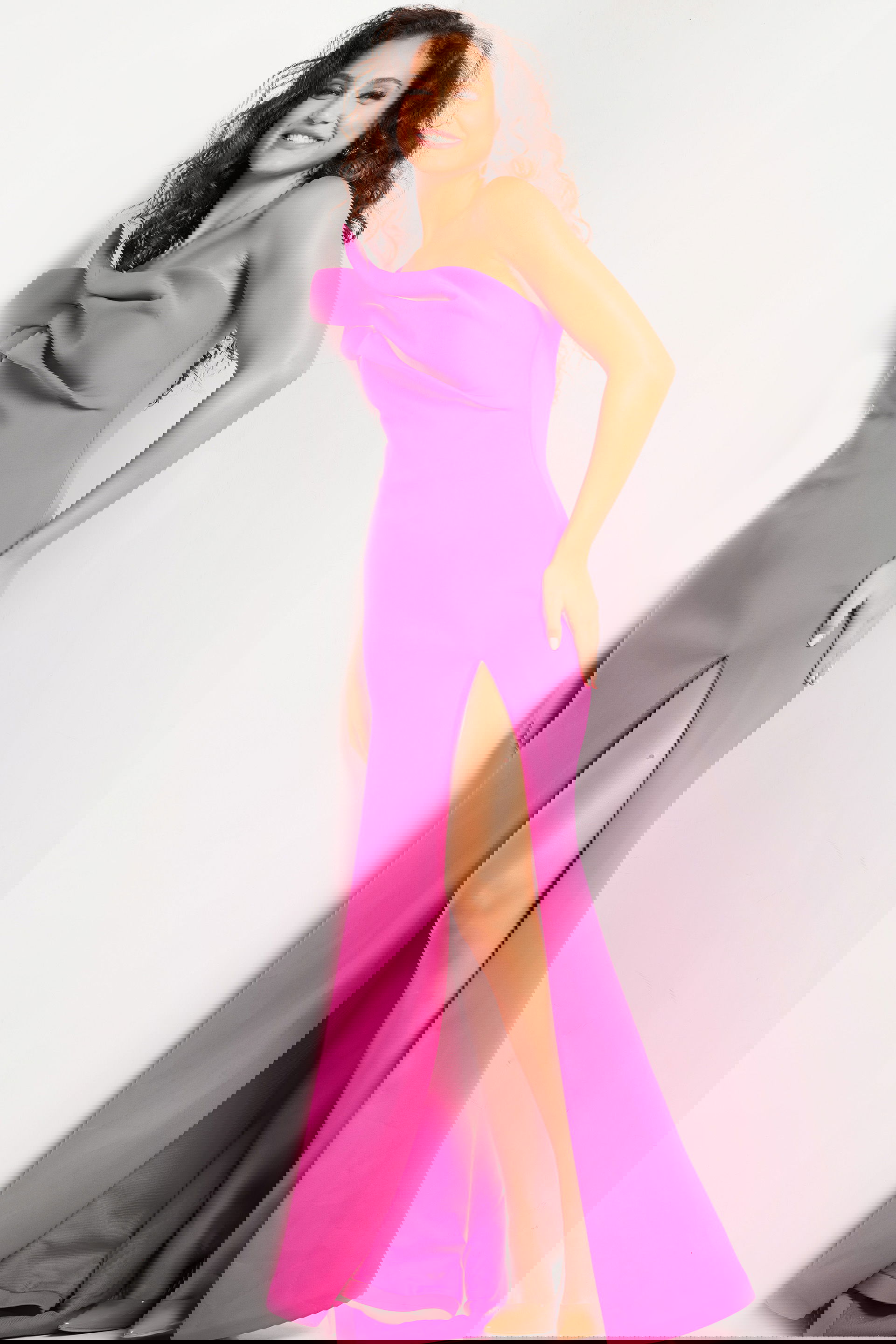 24018_FUCHSIA_22.jpg model wearing Jovani 24018 fuchsia gown with off-the-shoulder neckline and high slit from the front
