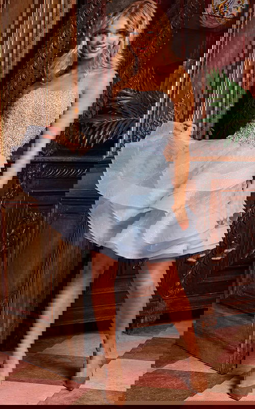 Model wearing Jovani K24050, full-length front view in blue elegant dress.