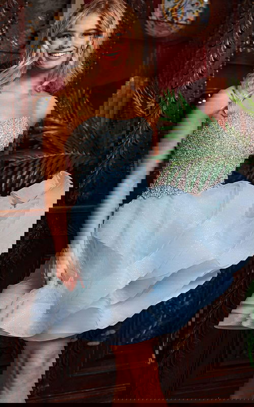 Model wearing Jovani K24050, blue dress, front view detail with sparkling bodice.