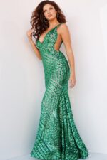 Model in Jovani 24097 gown showing green beadwork, front pose.