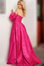 Model wearing Jovani 24099 fuchsia dress showcasing the back with puff sleeves.