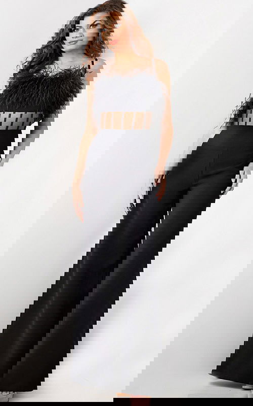 Model wearing Jovani 24144 black jumpsuit with feathered bodice and wide-leg pants, front view.