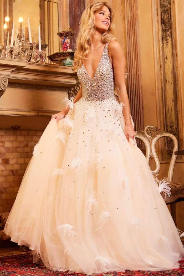 Model in Jovani 24255 dress with V-neckline and sparkling A-line skirt in nude.