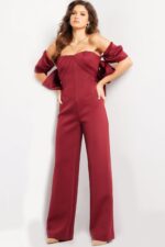 Model showcasing Jovani 24278 burgundy dress with elegant wide-leg fit.