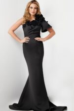Model wearing Jovani 24279 black dress with asymmetrical floral design