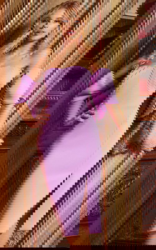 Model wearing Jovani 38078 lilac dress with strapless neckline and off-shoulder sleeves.