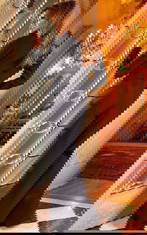 Back view of Jovani 24297 featuring sleek black jumpsuit with long sleeves.