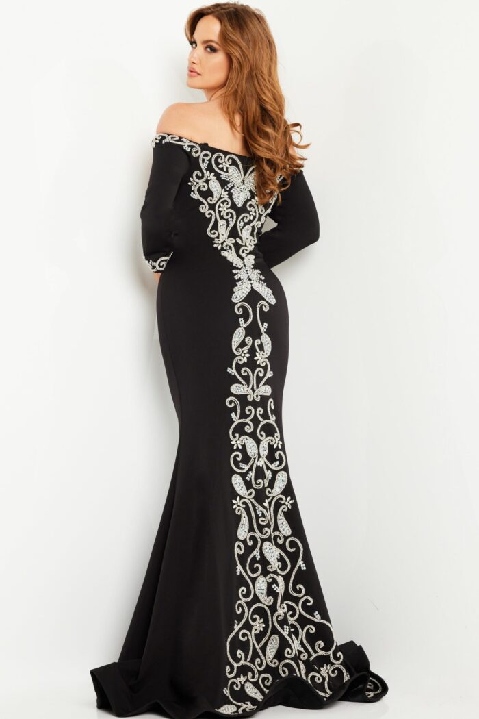 Model wearing Jovani 24328 black dress with back detailing.