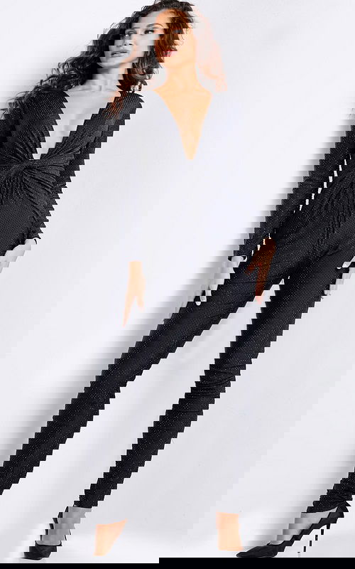 Model wearing Jovani 24537 black jumpsuit with deep V-neckline and long sleeves