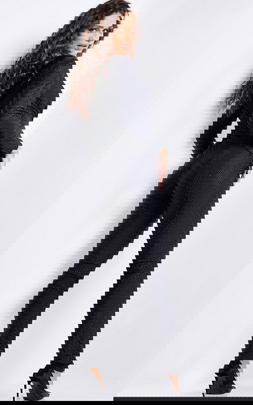 Back view of model wearing Jovani 24537 black jumpsuit with elegant design