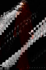 Model wearing 24566 blush jumpsuit with sequins and long sleeves, front view.