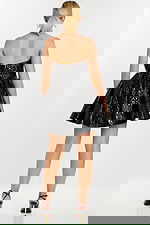 Back view of strapless black mini dress with embossed floral pattern and flared skirt.