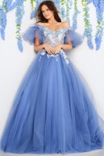Model displaying Jovani 24575 gown with flowing tulle skirt and floral detail.