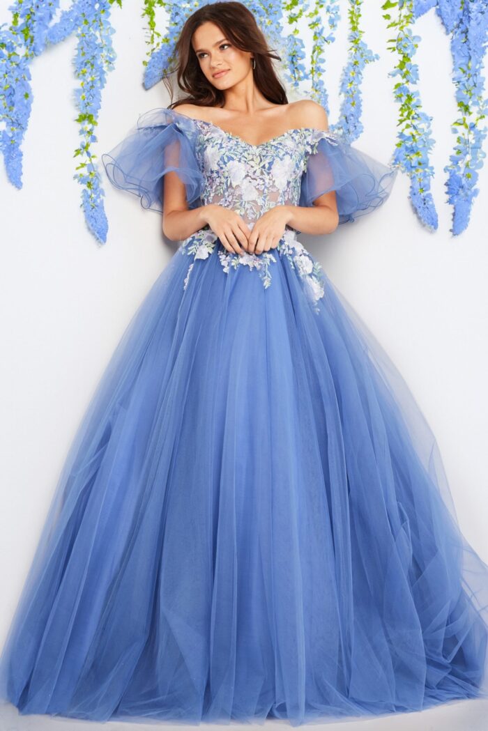 Model displaying Jovani 24575 gown with flowing tulle skirt and floral detail.