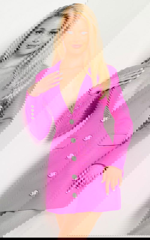 Model wearing 24619 hot pink mini dress with a deep V-neckline and button embellishments.