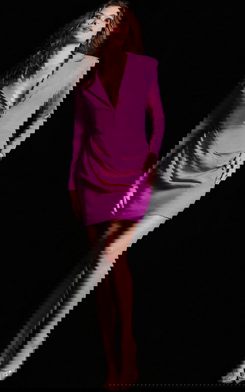Model wearing Jovani 24634 fuchsia mini dress with a plunging neckline and long sleeves