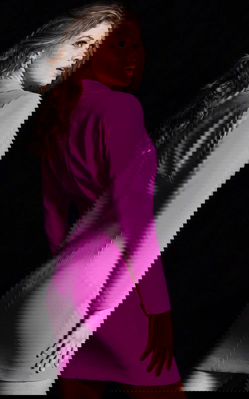 Back view of model in Jovani 24634 fuchsia mini dress