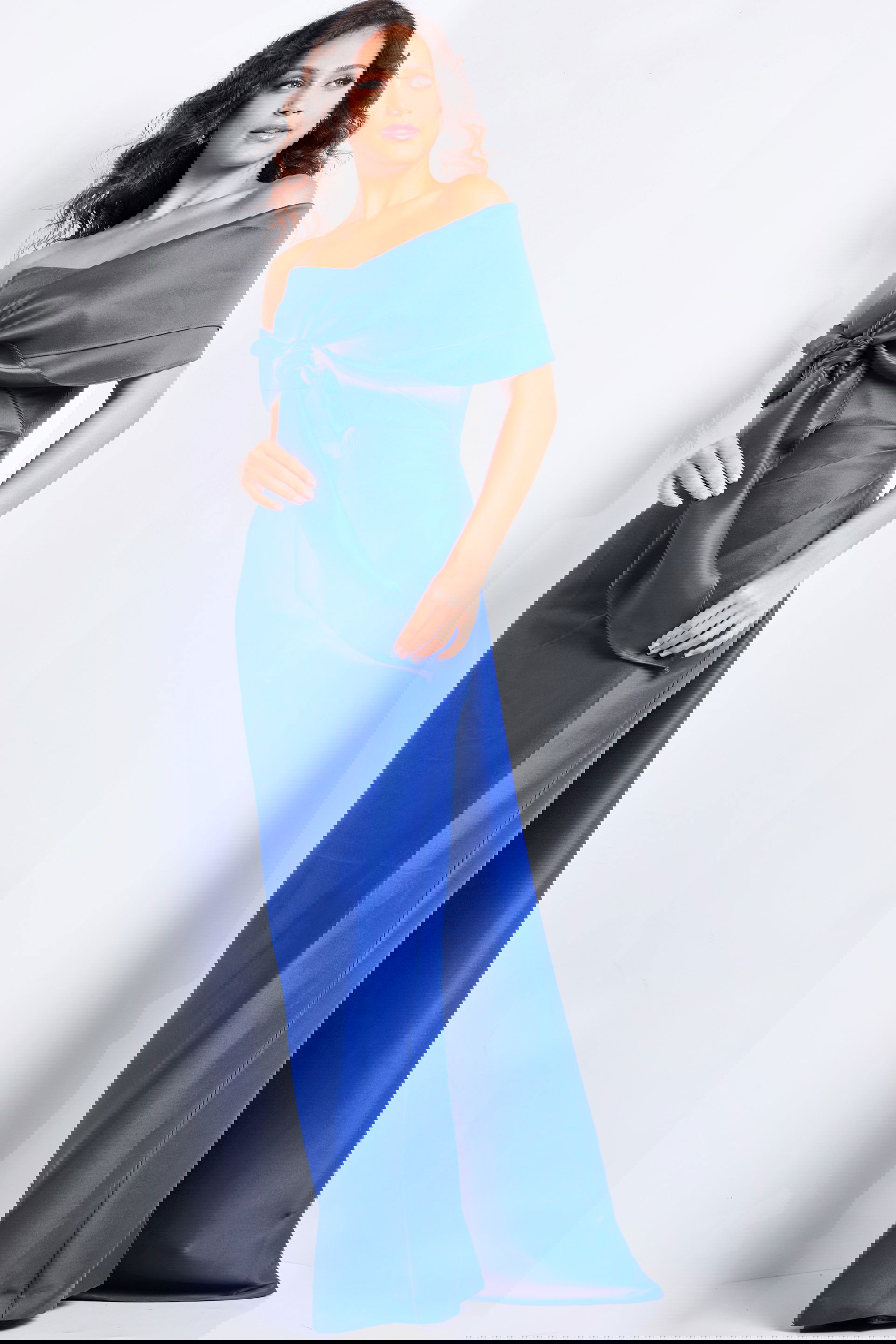 24641_PURPLE_2039.jpg Model wearing Jovani 24641 purple off-the-shoulder floor-length dress, front view.