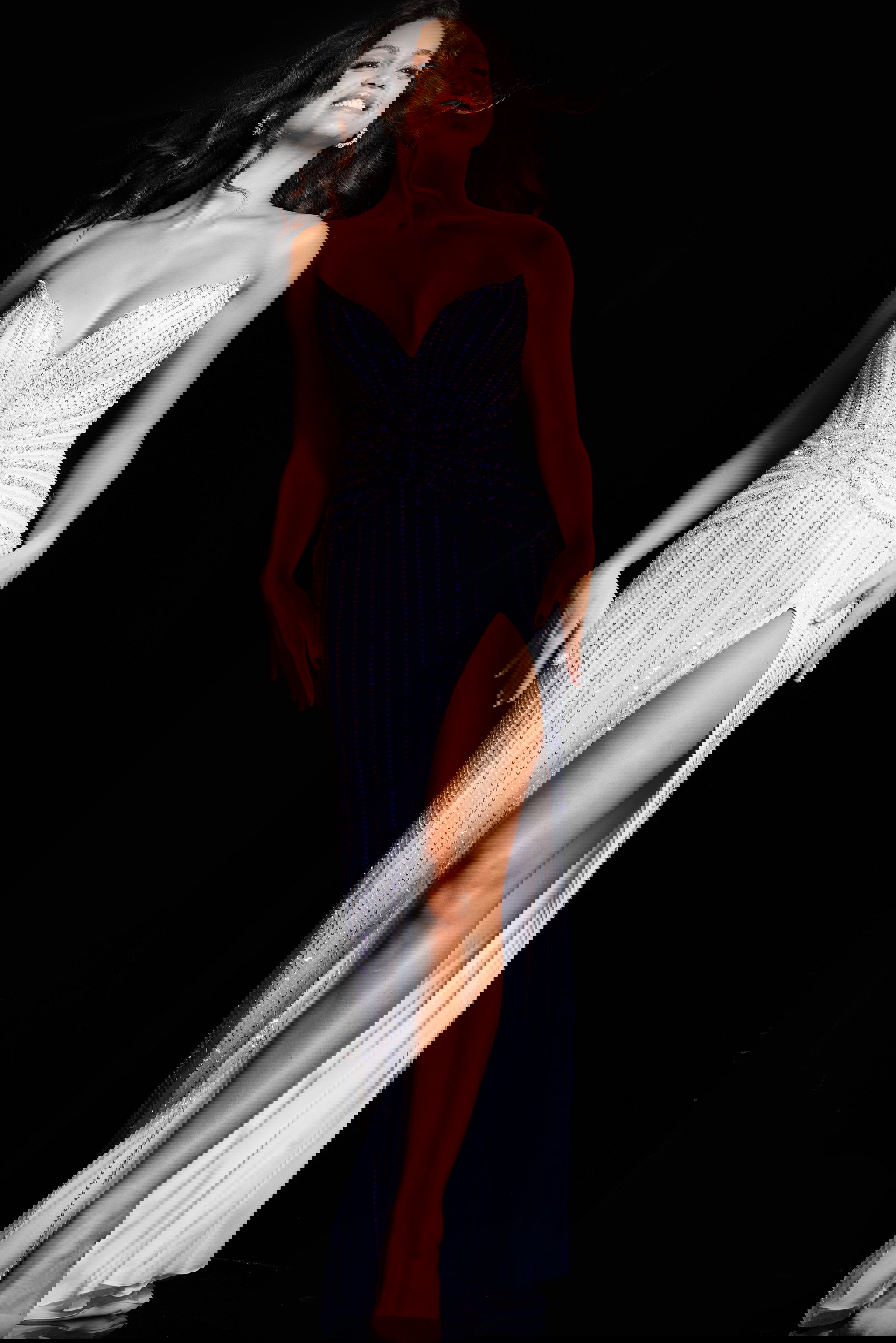 24654_OFFWHITE_34.jpg Model wearing Jovani 24654 floor-length dress with sweetheart neckline and high slit, front view.