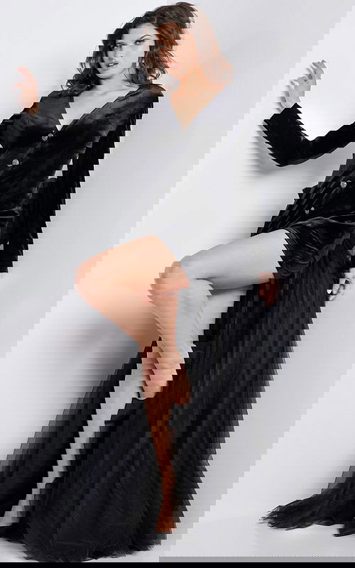 Model wearing Jovani 25741 black dress with V-neckline and tulle train