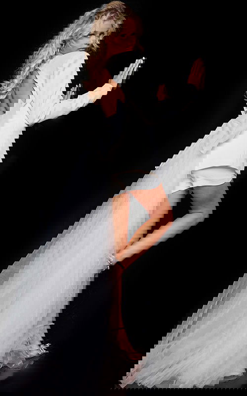 Back view of Jovani 25742 white dress with open back and tulle train.