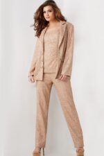 Model wearing Jovani 25773 beige sequin blazer and trousers ensemble, alternative front view.