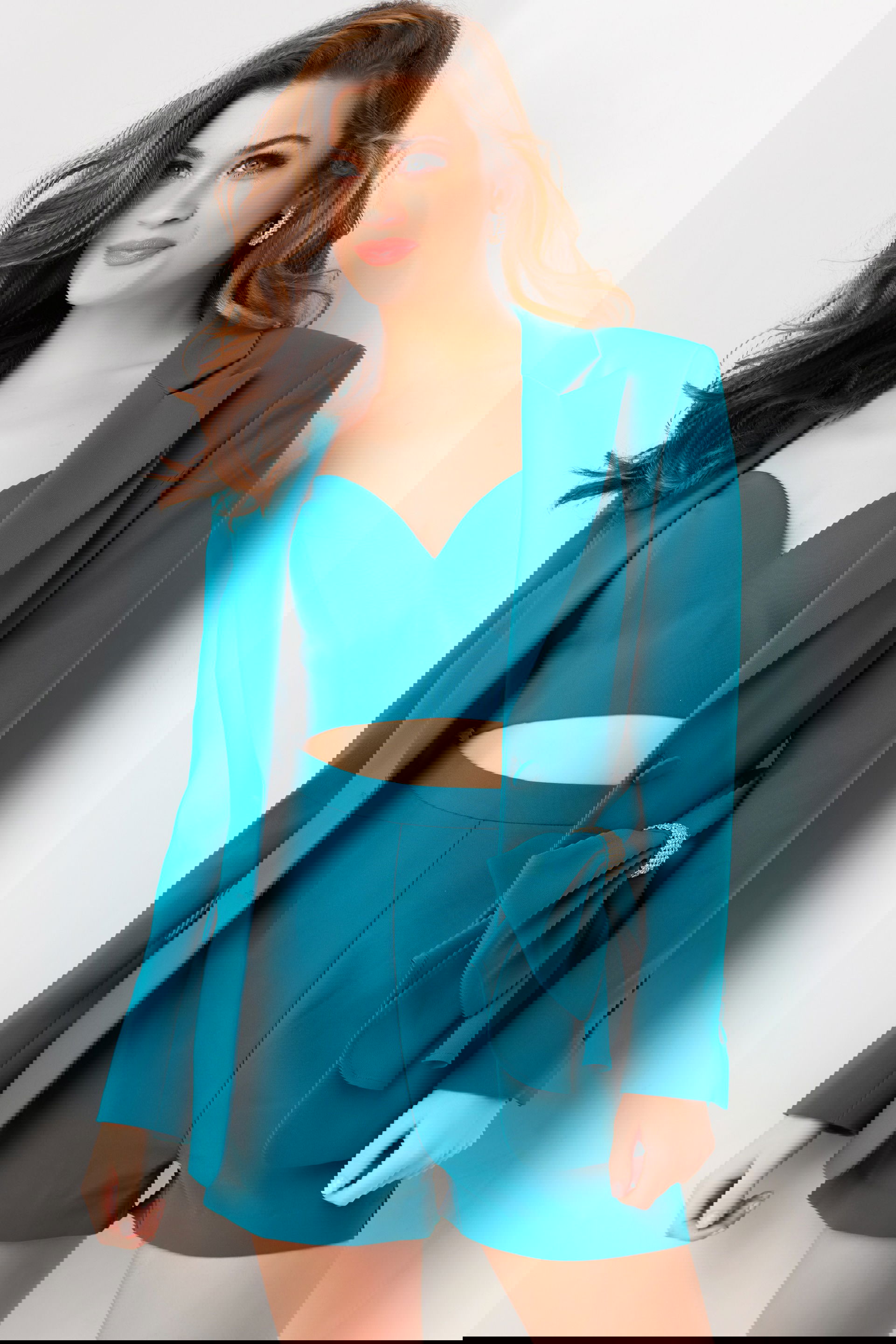 25840-TEAL-4.jpg Model wearing Jovani 25840 teal blazer and shorts set with bow detail.