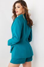 Back view of model in Jovani 25840 teal blazer and shorts set.