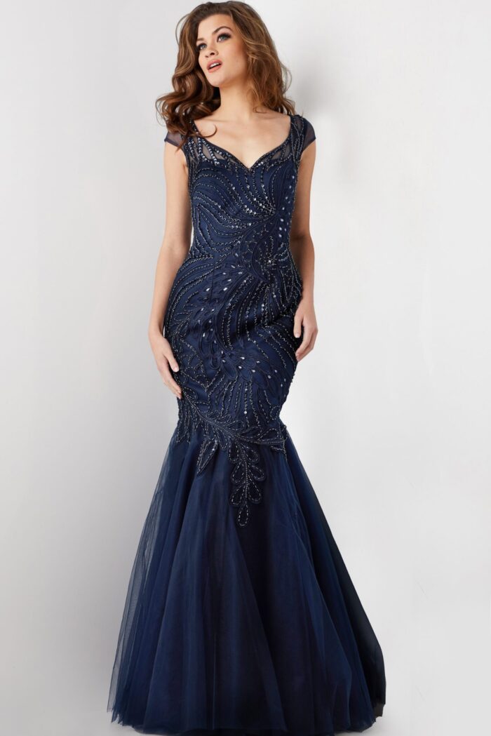 Model in Jovani 25850 navy dress, front view, showcasing intricate sequin embroidery.