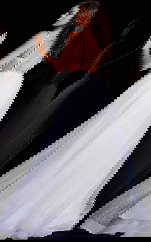 Back view of model wearing Jovani 25990 white gown with open back design.