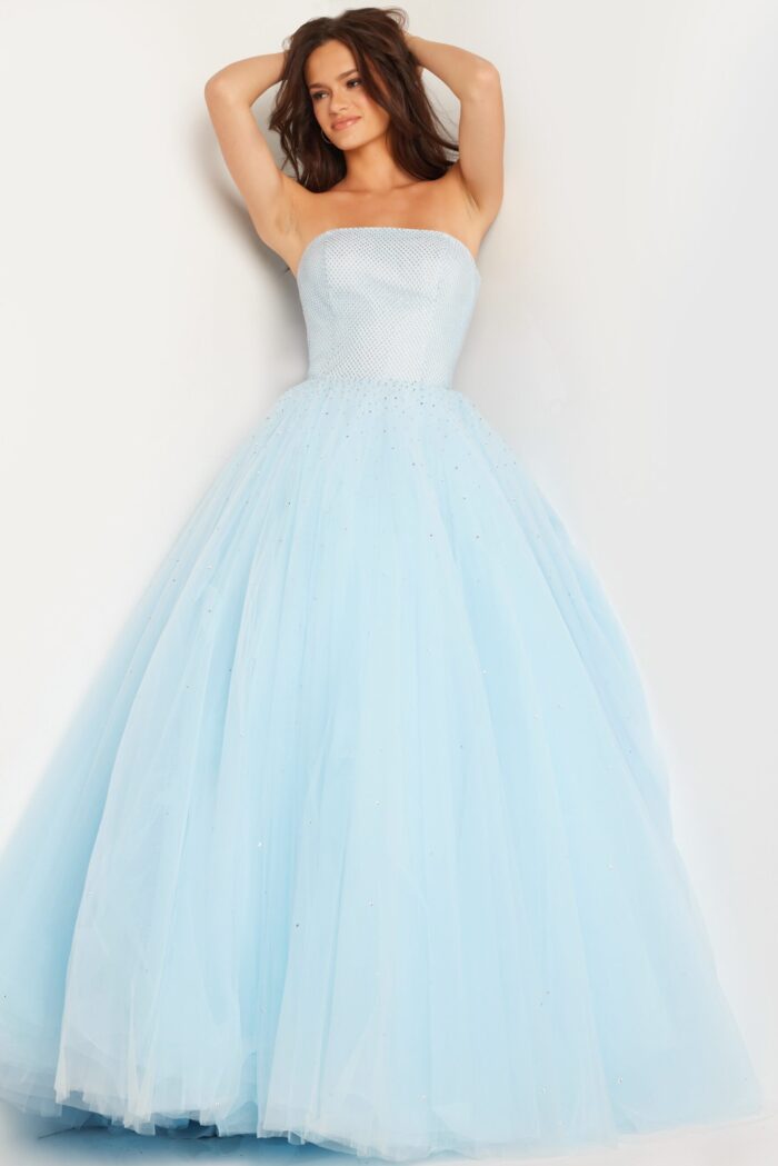 model wearing Jovani 25991 blue ball gown, relaxed pose, front view.
