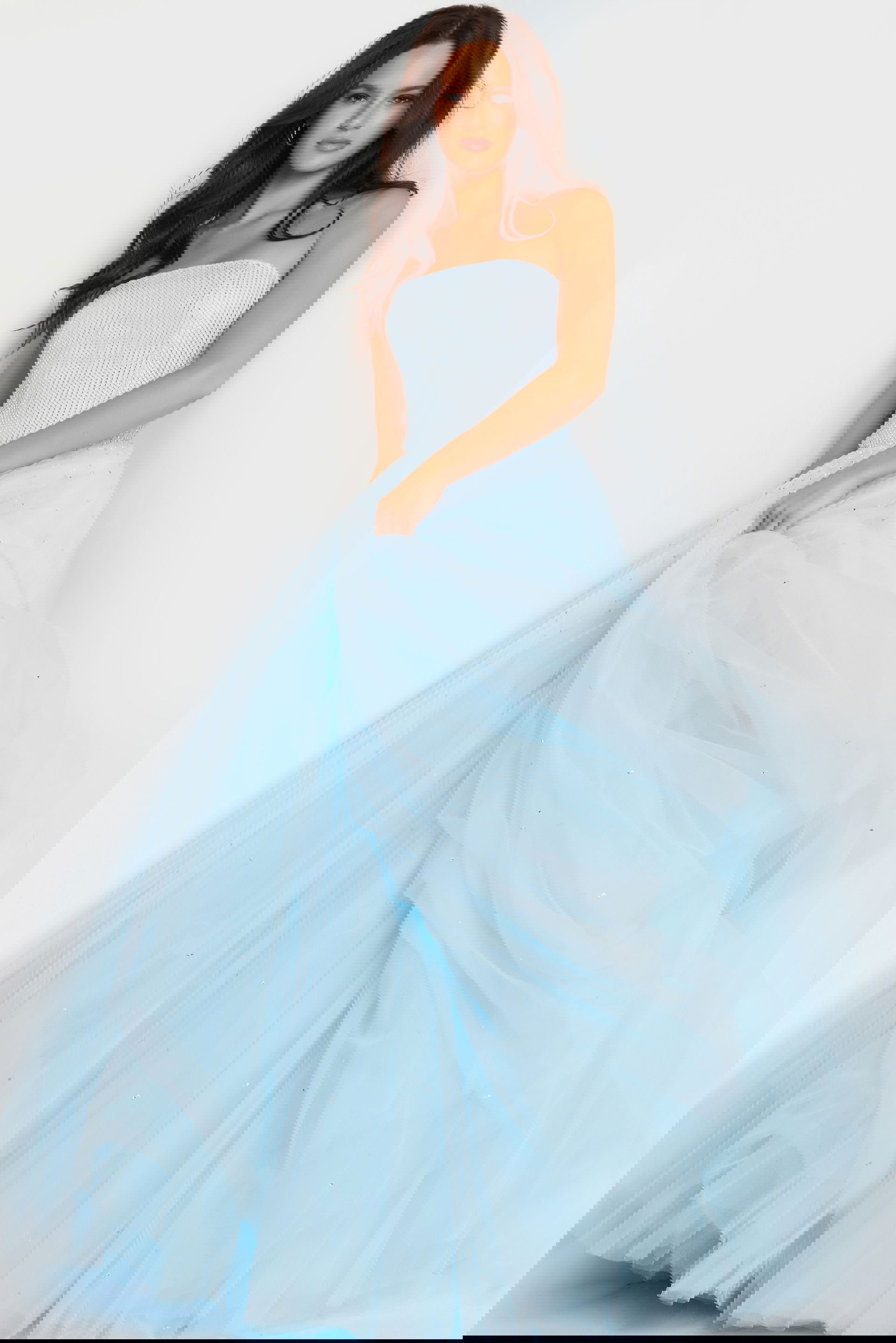 25991_3.jpg model wearing Jovani 25991 blue ball gown with strapless neckline, front view.