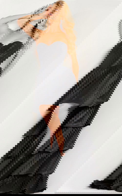 model wearing Jovani 26006 black dress with sweetheart neckline and tiered ruffles