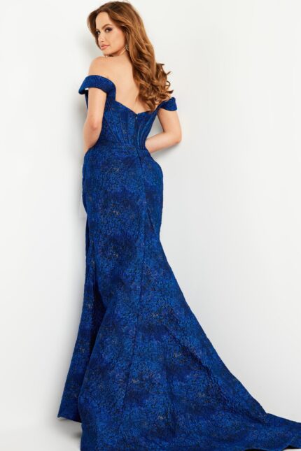 Model wearing Jovani 26017 cobalt blue gown with off-shoulder neckline, back view.