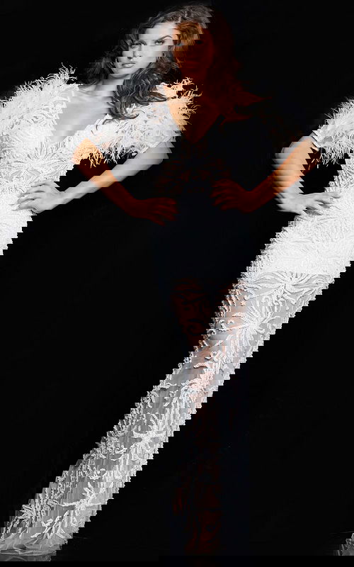 Model wearing Jovani 26057 white dress with feathered sleeves, front view.