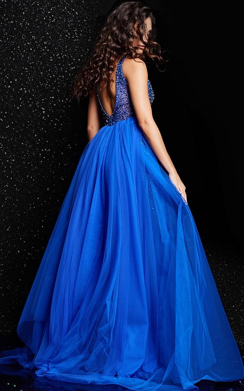 Back view of model wearing Jovani 26058 royal blue dress with scooped back and tulle overlay