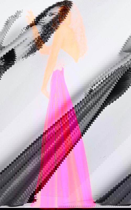 Model wearing Jovani 26117 black gown with fuchsia train, back view showcasing intricate embellishments.