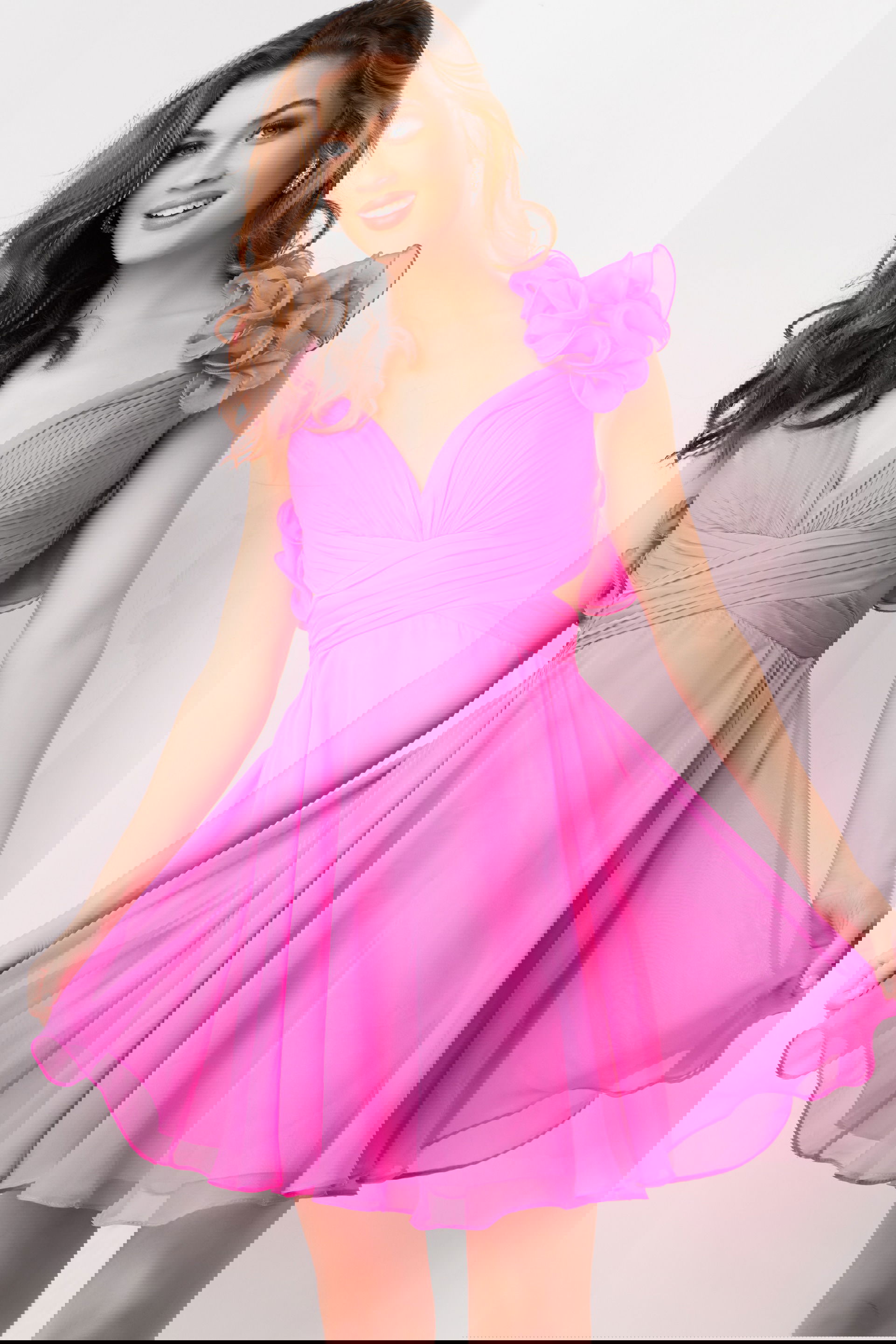 26139-HOTPINK-23.jpg Model wearing Jovani 26139 vibrant pink dress with sweetheart neckline and ruffled shoulders, front view.