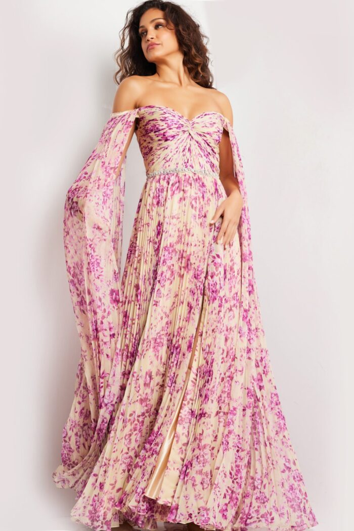 Model wearing Jovani 26141 with a printed design and flowing draped sleeves from a front angle.